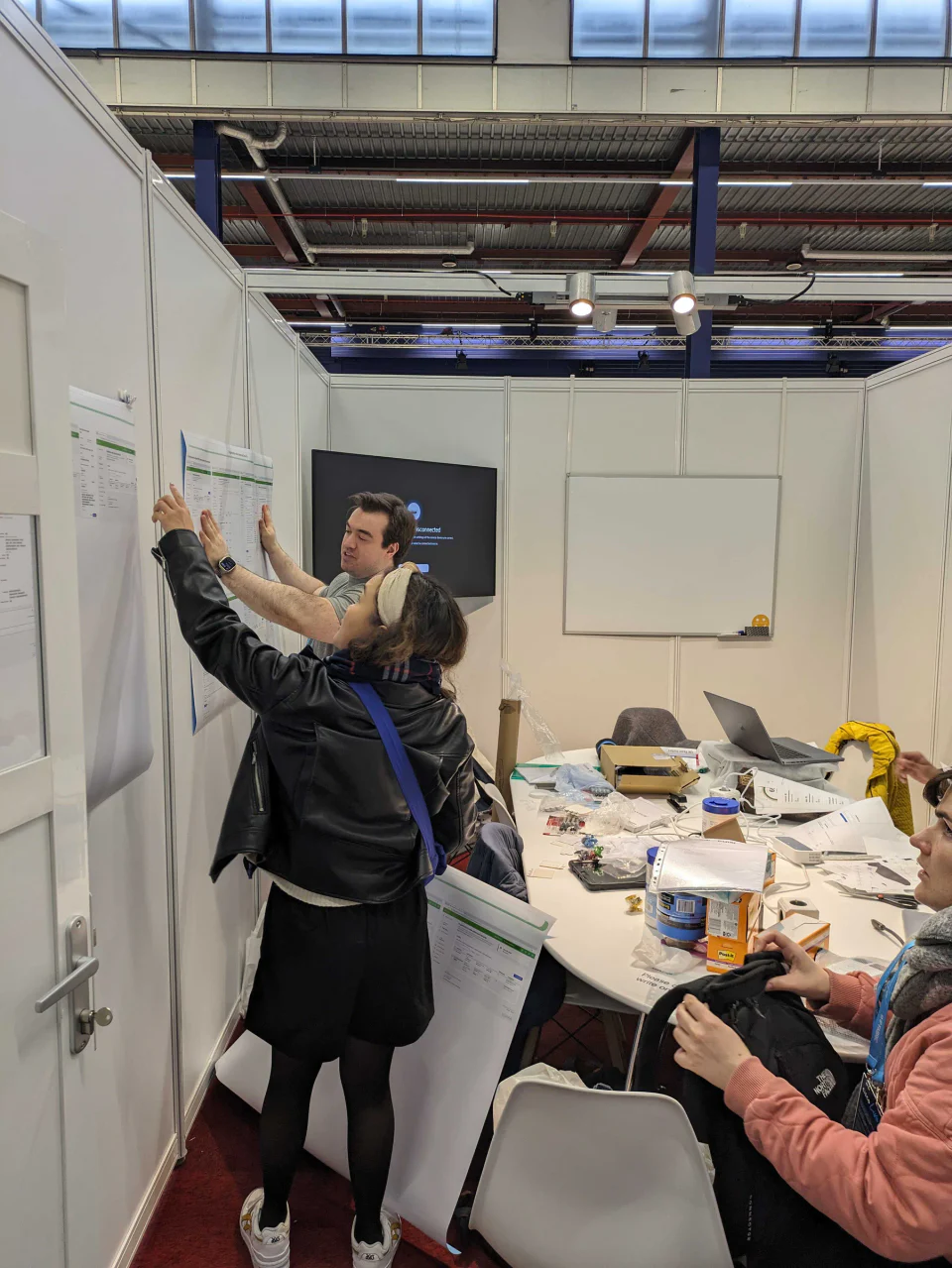 Cisco Live participant reviewing printed Multicloud Fabric workflows with the design team.