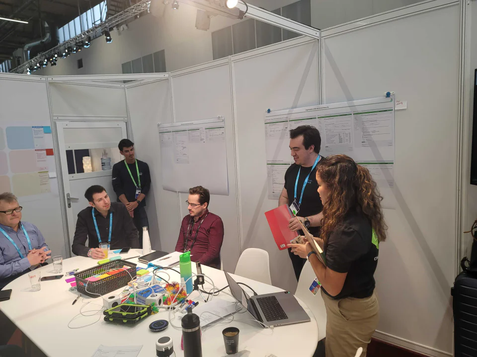 Cisco Live research session with administrators reviewing Multicloud Fabric concepts and printed screens.
